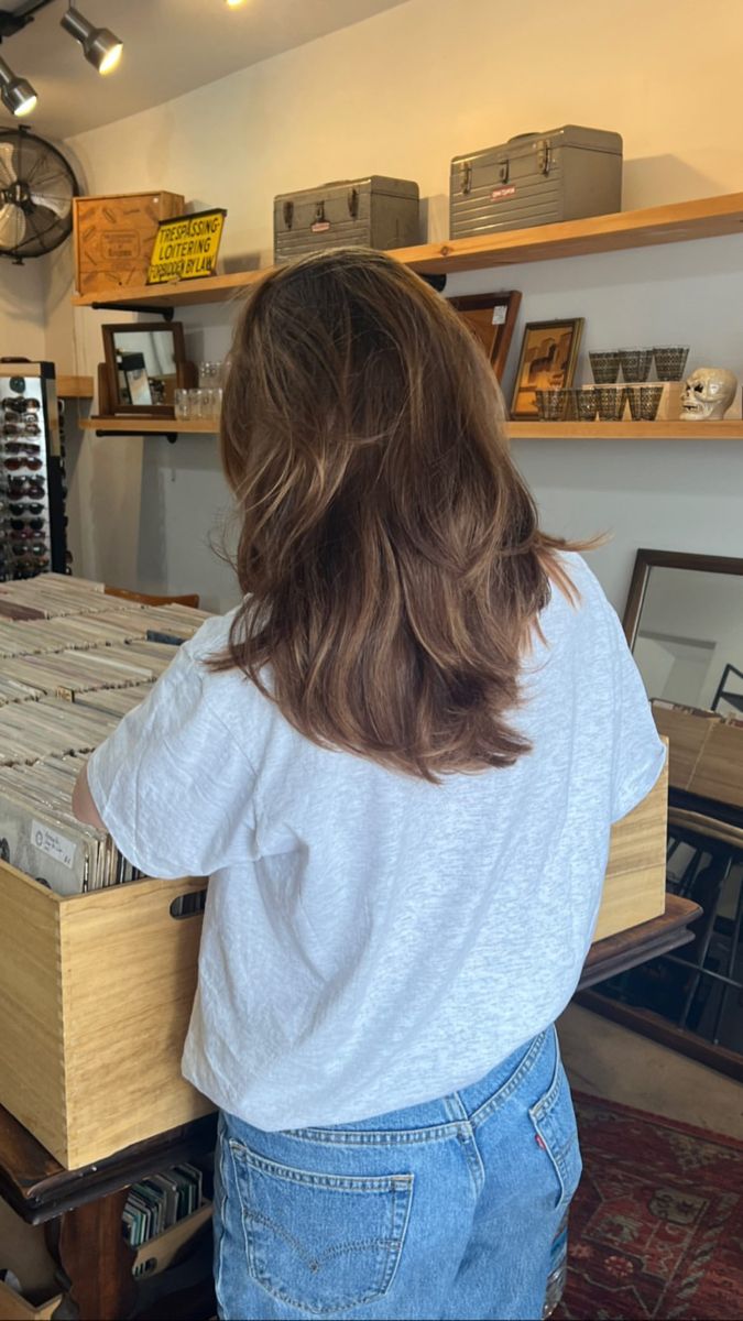 photo of a woman in a record shop taken from behind